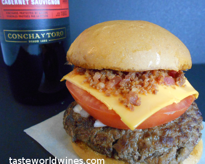 Home Made Burger with Cheese, Bacon Bits, Tomato, and Onions 